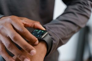 A detailed view of a smartwatch tracking fitness on a person's wrist.