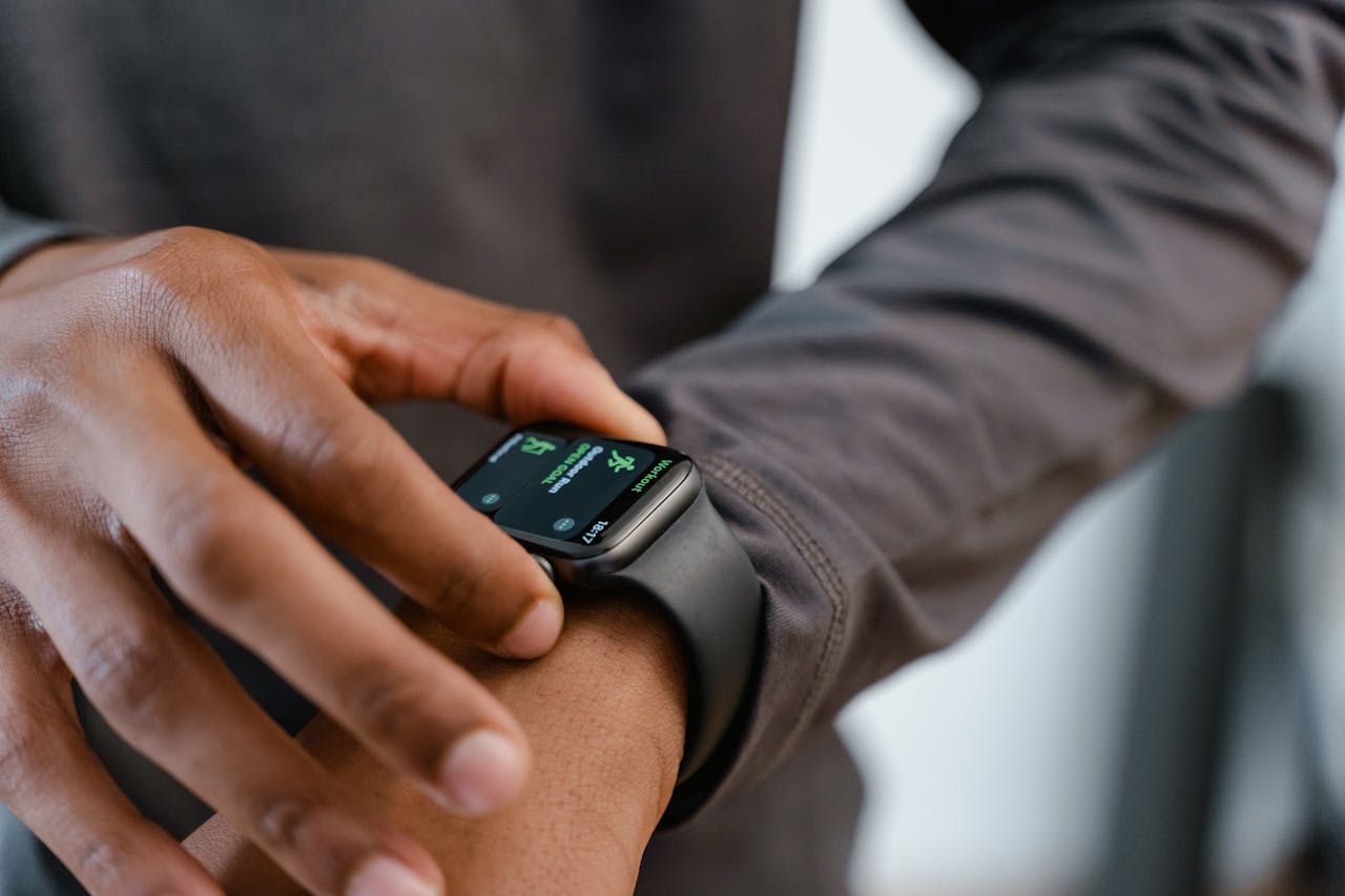 A detailed view of a smartwatch tracking fitness on a person's wrist.